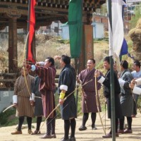 Archery is Bhutan's national sport.  Note the national traditional dress.