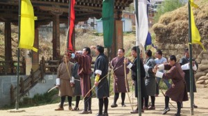 Archery is Bhutan's national sport.  Note the national traditional dress.
