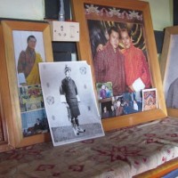 Families have shrines to Buddha and to the royal family - cherished  photos of the current king and his father are displayed in the bedroom of a farming family in the mountains.